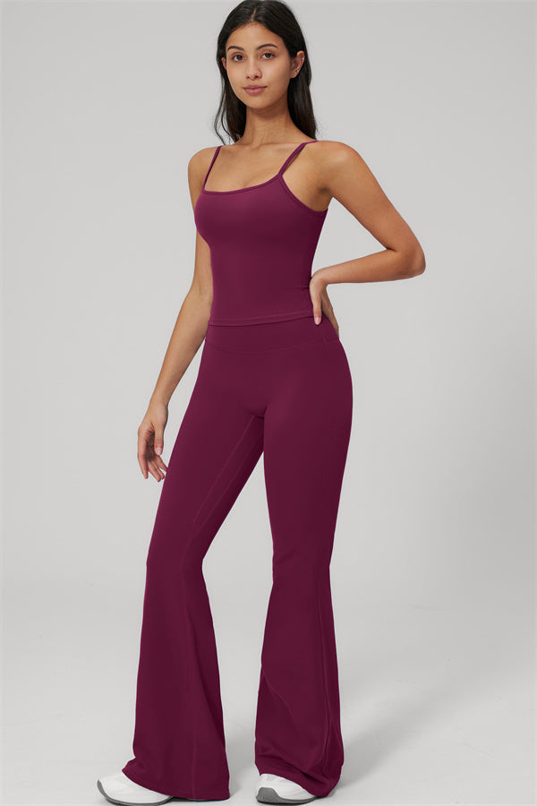The Rapture Tank Top Flared Leggings 2-Piece Set in burgundy worn by a model, showcasing a stylish and comfortable fit.