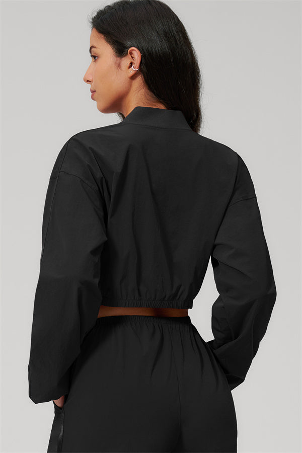 The Spunk UV protection Jacket Sweatpants 2-Piece Set showcasing a black jacket from the back with a cropped design and belted waist.