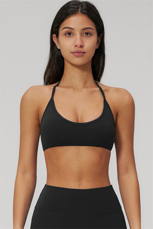 The Rapture Sports Bra Leggings 2-Piece Set featuring a sleek black sports bra with halter neckline.