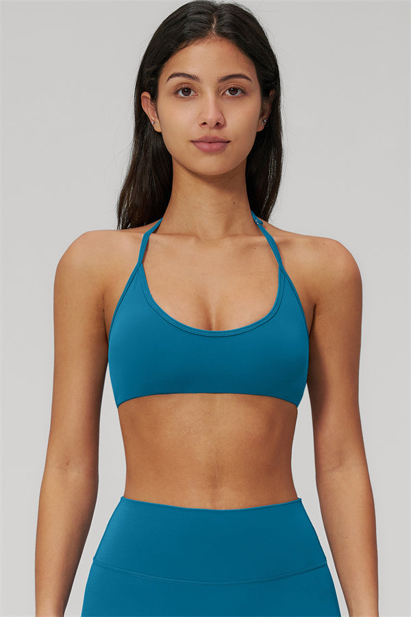 The Rapture Sports Bra Leggings 2-Piece Set sports bra in teal color, designed for comfort and support.