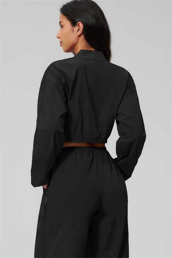 The Spunk UV protection Jacket Sweatpants 2-Piece Set in black, showcasing the back view with relaxed sporty silhouette.
