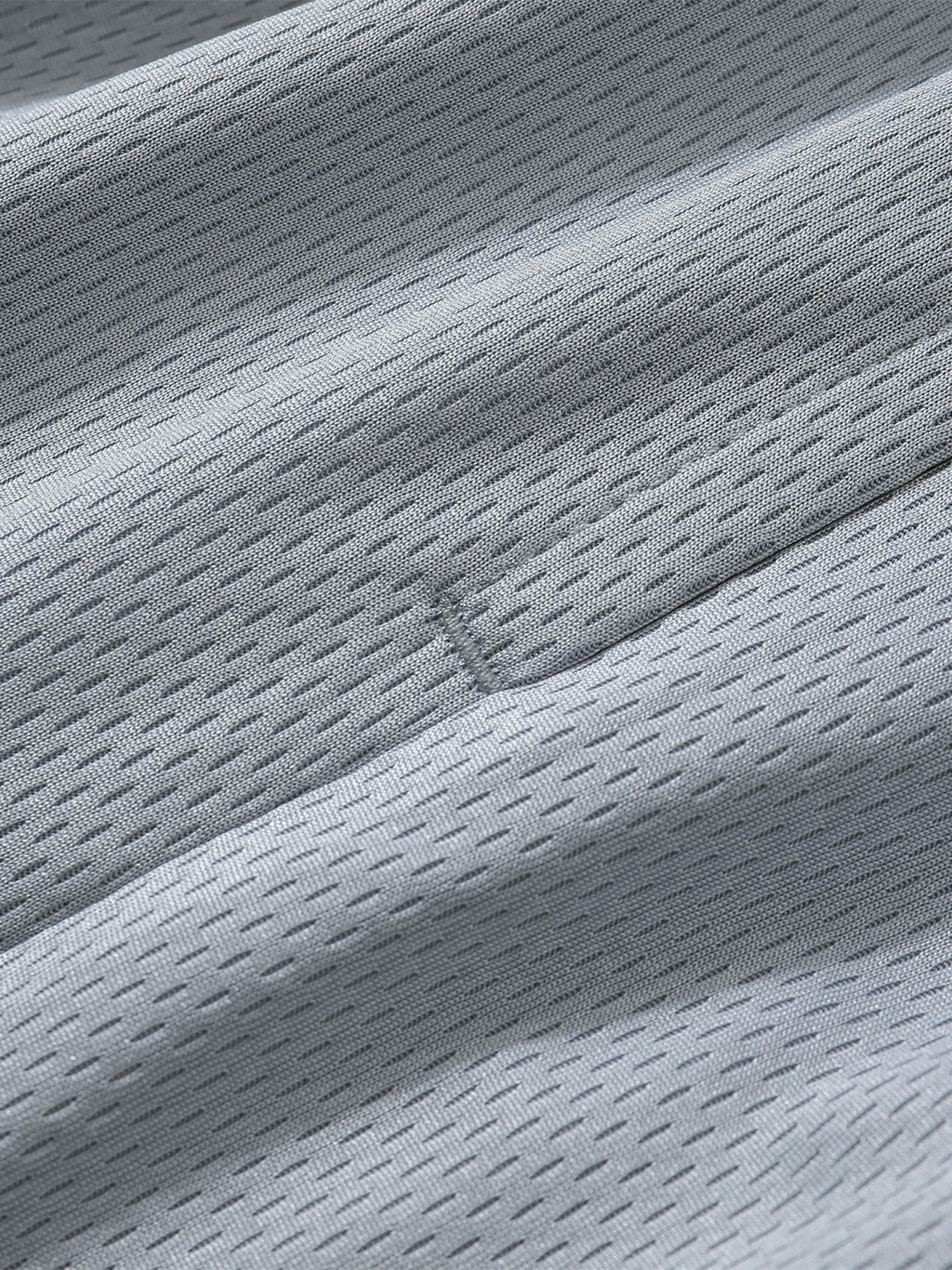 Detail of breathable fabric used in Loki & Ivy Classic Stripe Trim Basketball Shorts.