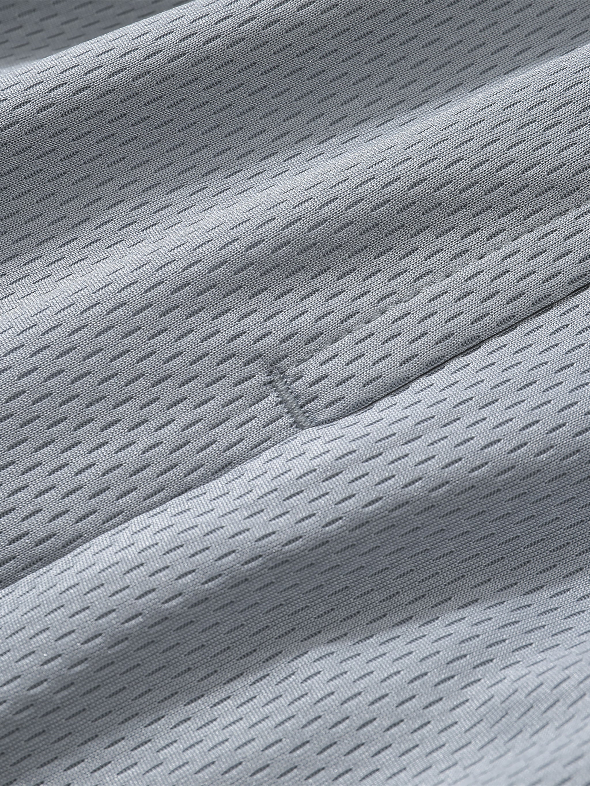 Detail of breathable fabric used in Loki & Ivy Classic Stripe Trim Basketball Shorts.