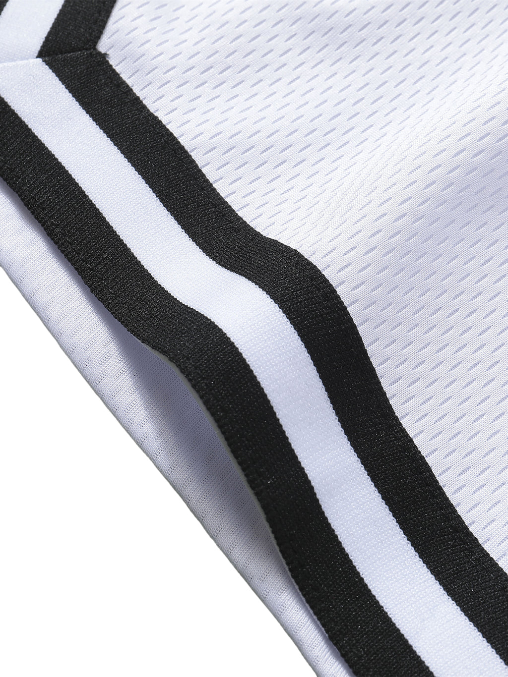 Close-up of Loki & Ivy Classic Stripe Trim Basketball Shorts showcasing the stylish black and white stripe trim.