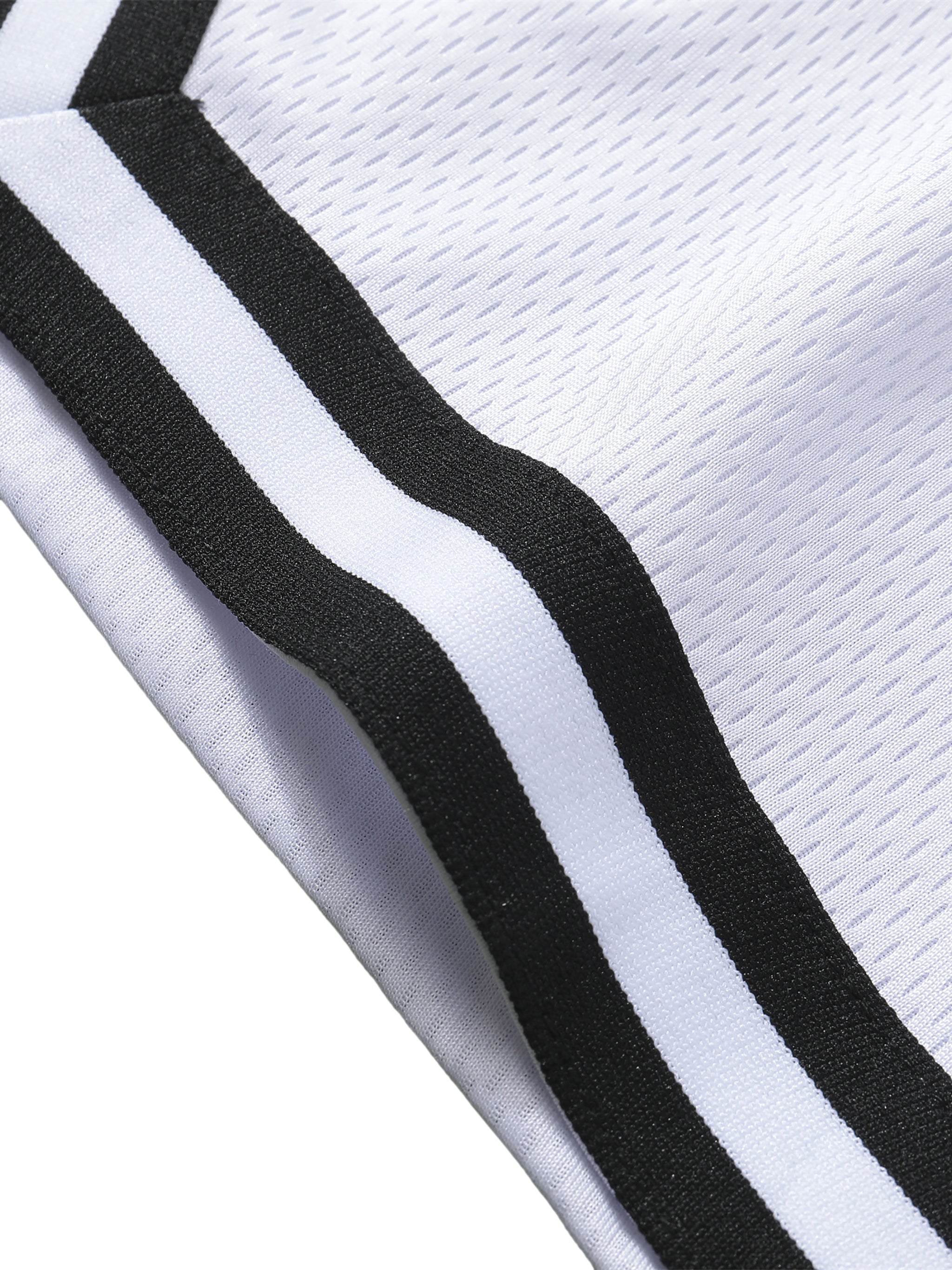 Close-up of Loki & Ivy Classic Stripe Trim Basketball Shorts showcasing the stylish black and white stripe trim.