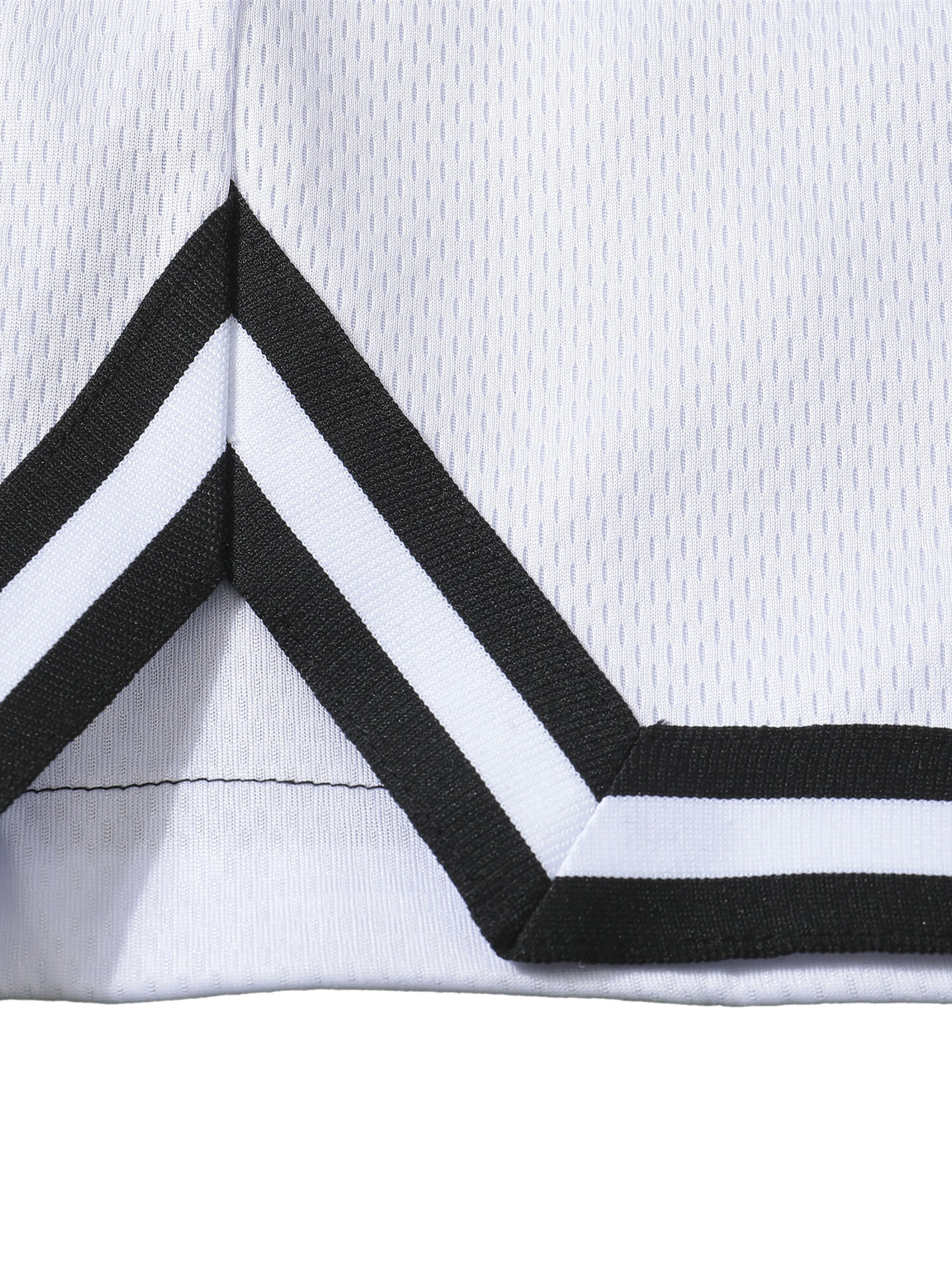 Close-up of Loki & Ivy Classic Stripe Trim Basketball Shorts showcasing the stripe trim detail.