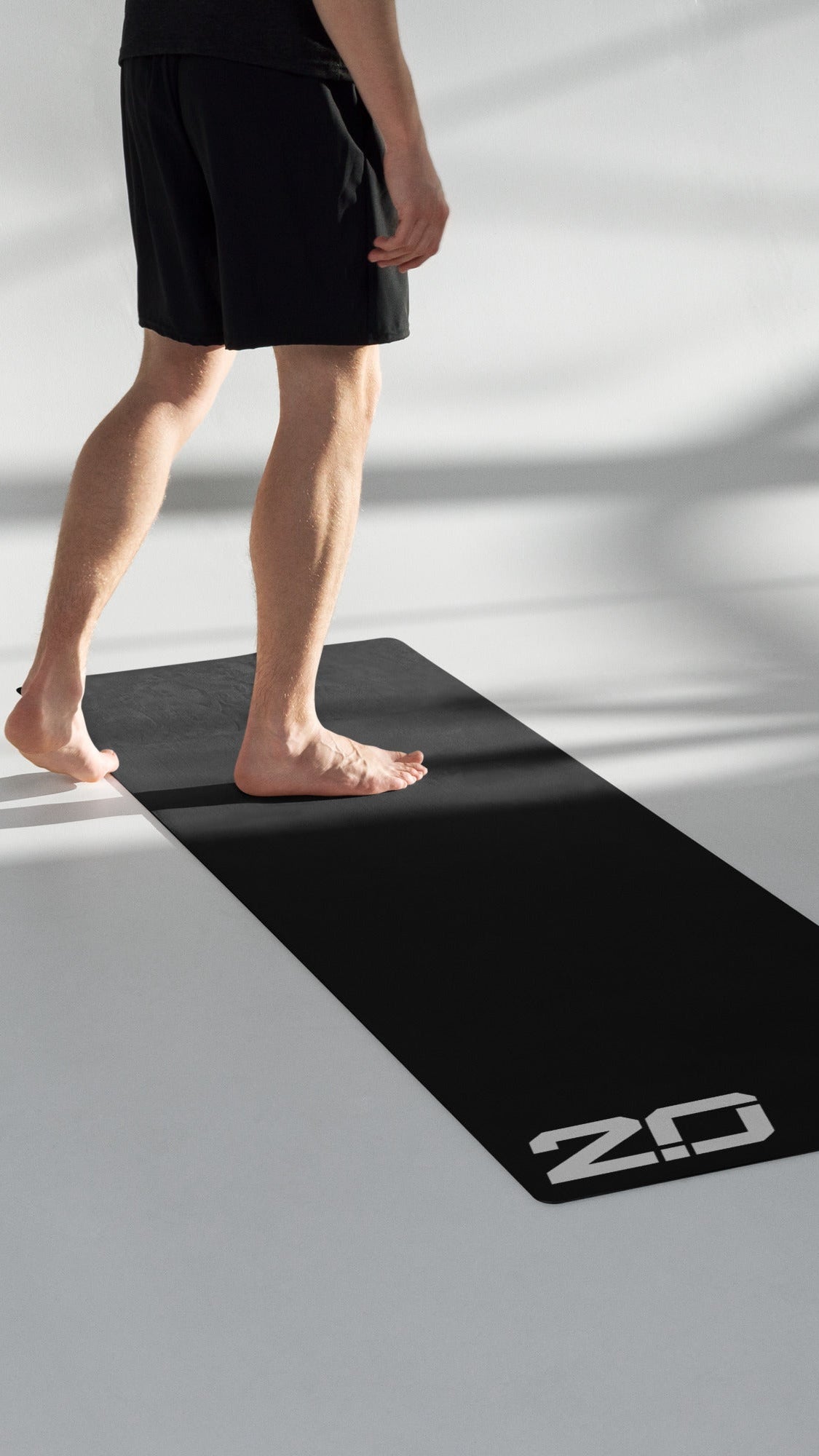 Person standing on a New Upgraded Premium Gym Yoga Mat, ideal for exercising and stretching.